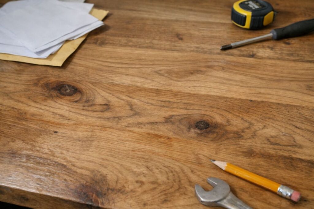 an illustrative image of a close up on a solid wood desk