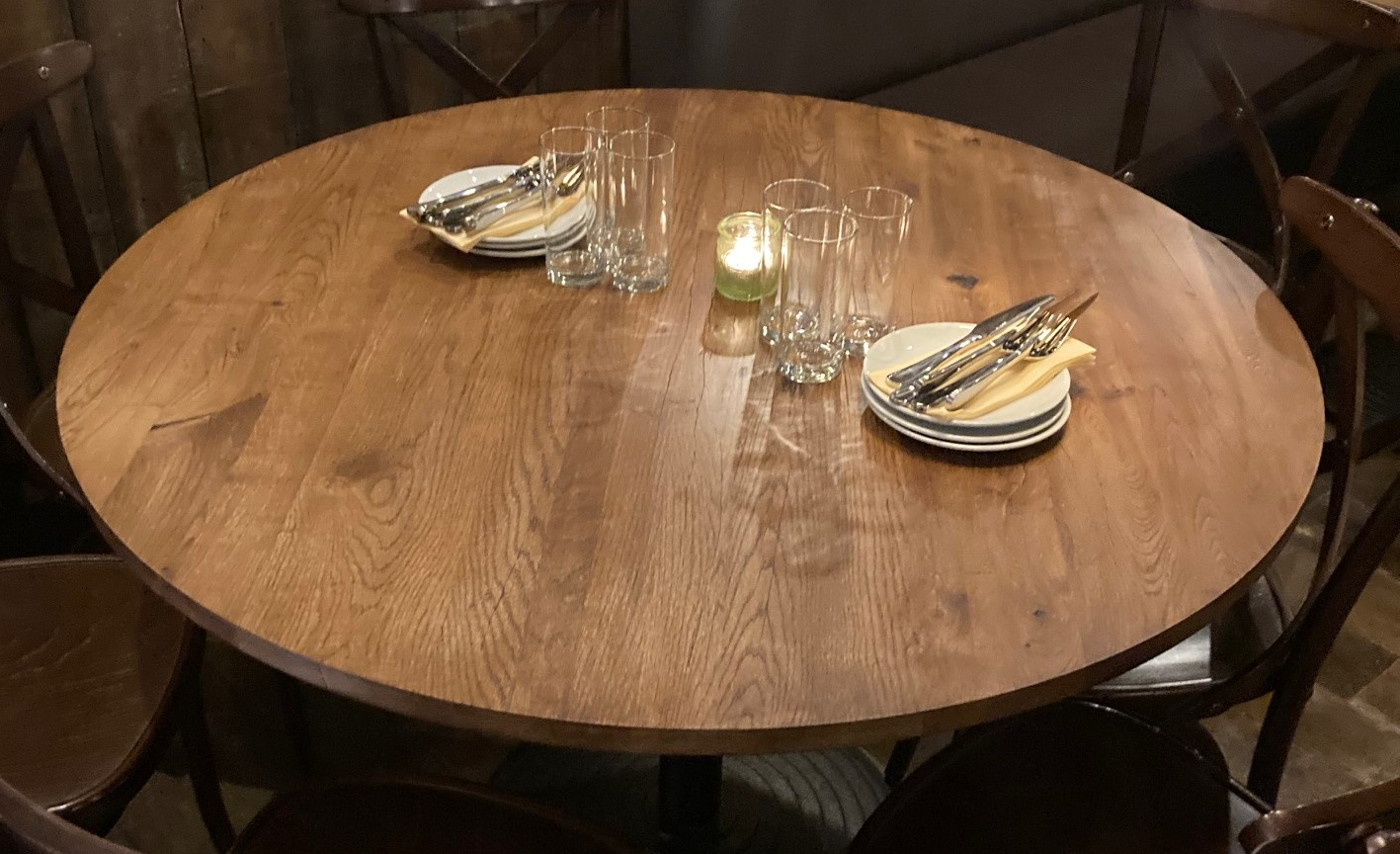 Round restaurant table top in use
