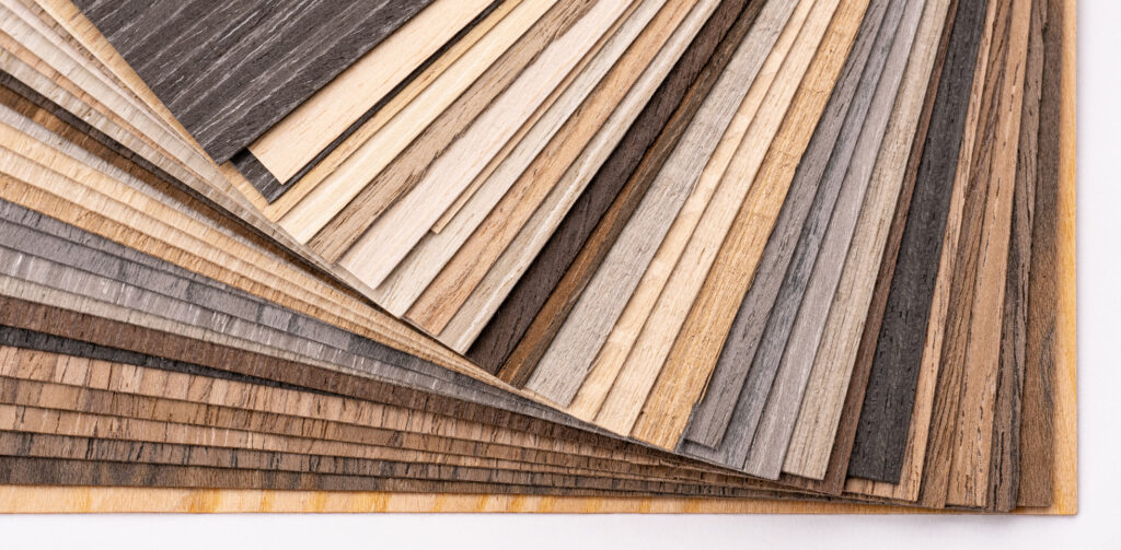 Stack of thin wood veneer sheets, each less than a millimetre thick