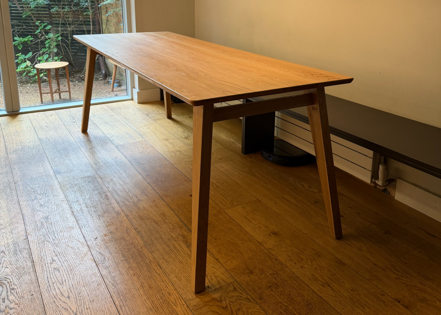 Nordic style solid oak table with angled legs